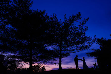 The bride and groom at dusk